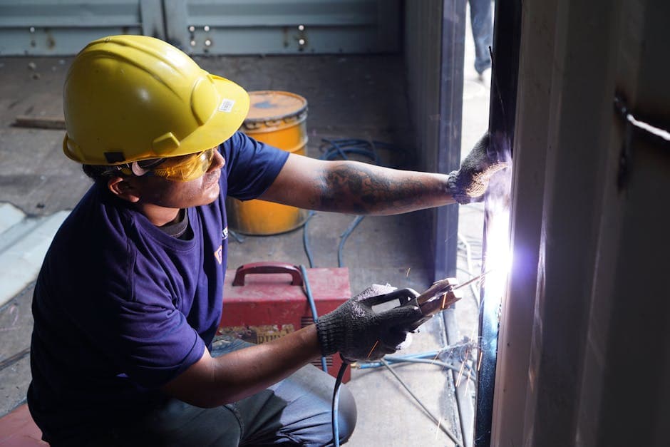 Building Services Technician working on facility maintenance